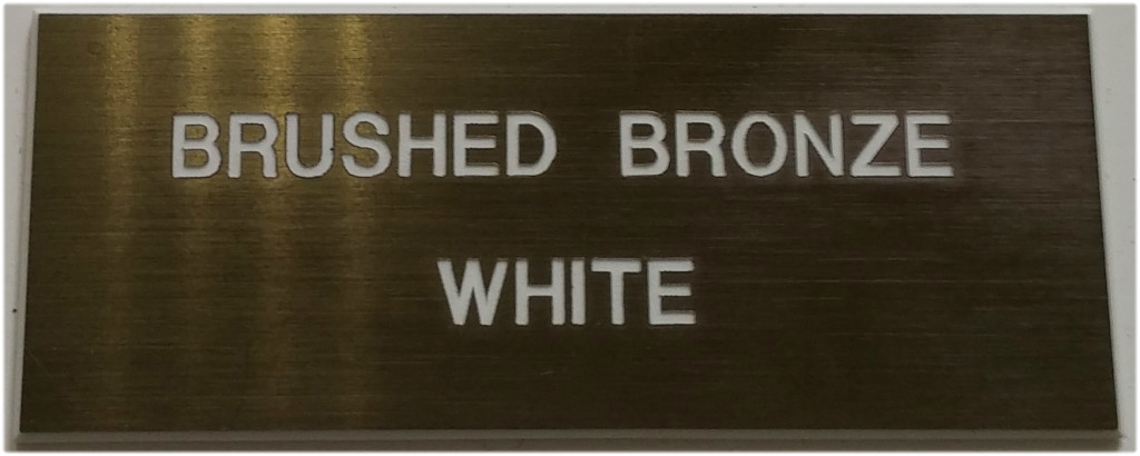 brushed_bronze_and_white_letters